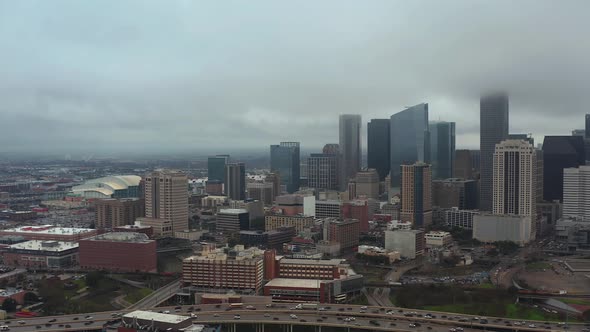 This video is about an aerial view of downtown Houston on  a gloomy and rainy day. This video was fi alt