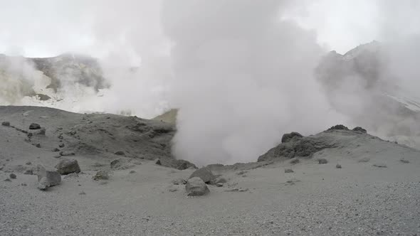 Volcanic activity - boiling thermal mud pot in crater active volcano