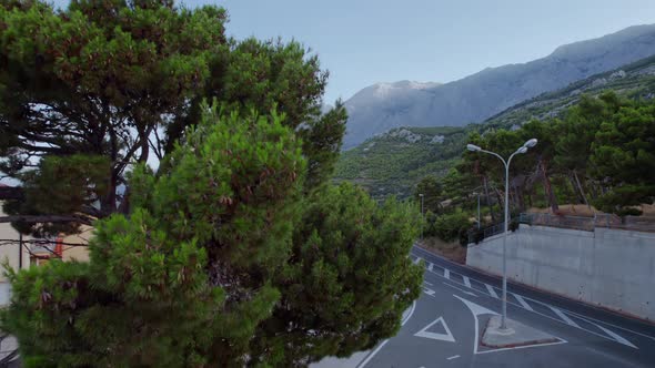 The Panorama of the Mountains the Sea and the Mountain Highway are Openning Up While the Drone Flies