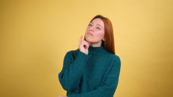 Young Red Hair Woman Posing Isolated on Yellow Color Background Studio alt