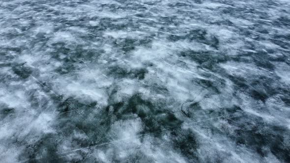 Drone fly over an icy lake. alt