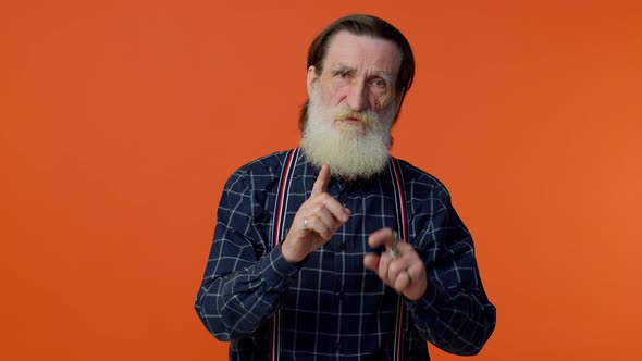 Elderly Old Man in Warning with Finger Gesture Saying No Be Careful Giving Advice to Avoid Danger alt