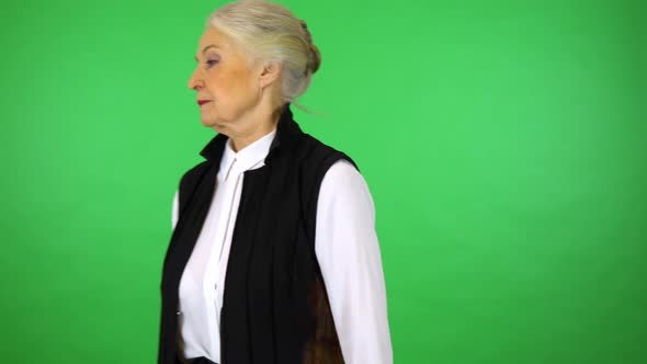 An Elderly Woman Walks Back and Forth and Thinks alt