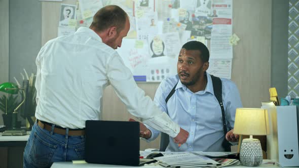 Diverse Detectives High Five After Hard Work alt