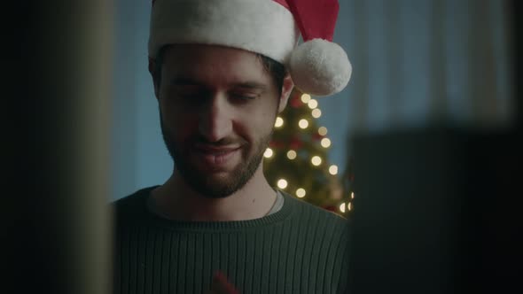 Boy looking for Christmas book in home library