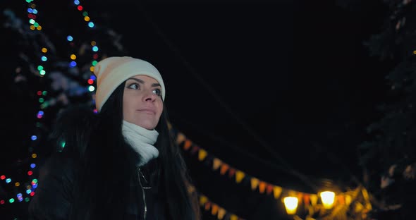 Girl Walks in the Evening Winter City alt