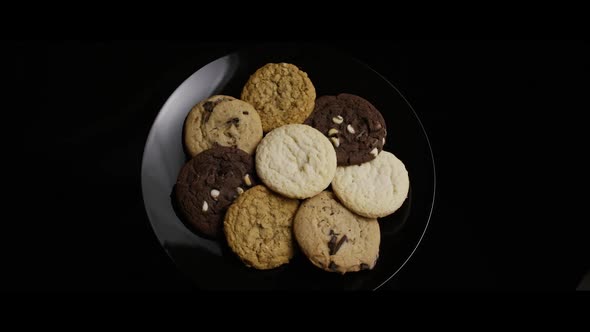 Cinematic, Rotating Shot of Cookies on a Plate  alt