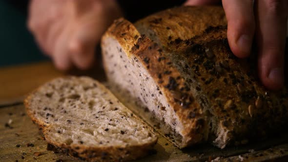 Slicing Homemade Seed Bread in slow motion