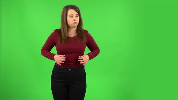 Pretty Girl Cooling Herself By Her Hand, Suffering From High Temperature Weather. Green Screen alt