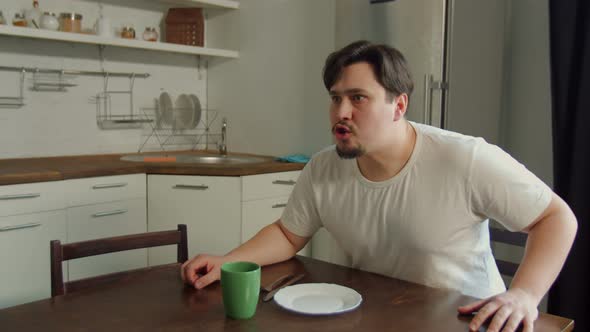 Angry Man Screaming, Threatening Woman in Kitchen alt
