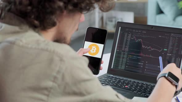 Business Man Trader Using Mobile Phone App and Laptop Analytics alt