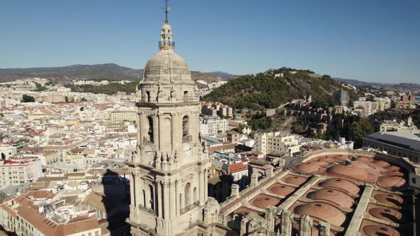 Pullback from Malaga Cathedral tower, Revealing Spanish cityscape. Spain