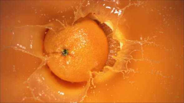 Orange Fruit Falling on Juice with Splash and Divided in Half, Stock ...