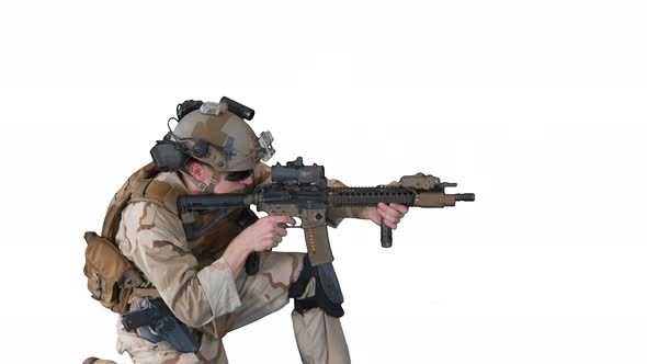 Paratrooper in Uniform Shooting From Sitting Position on White Background alt