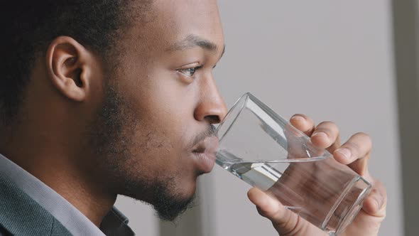Calm Handsome African American Guy Ethnicity Man Holding Glass of Mineral Natural Clean Water Make alt