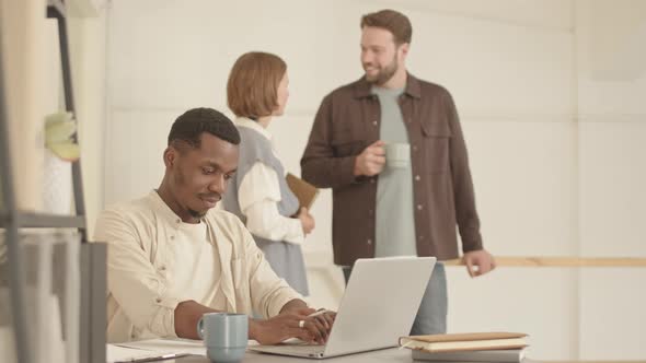 Black Man Working in Office alt