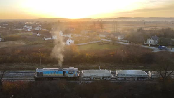 Aerial View of Cargo Train Loaded with Crushed Stone Materials at Mining Factory alt