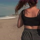 Sportswoman Running Along Sandy Coastline - VideoHive Item for Sale
