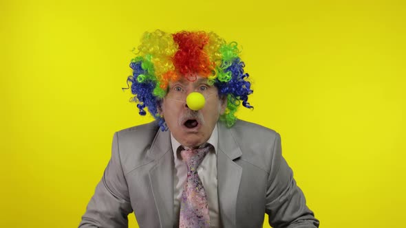 Senior Clown Businessman Entrepreneur Boss Making Silly Faces alt
