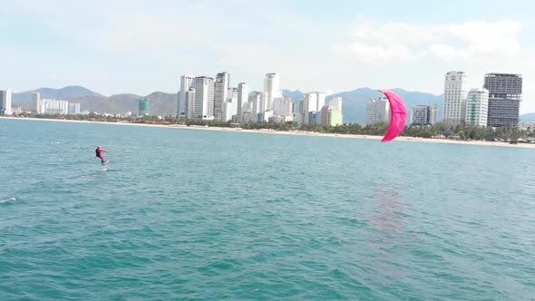 Kite Surfing Place, Sports Concept, Healthy Lifestyle, Human Flight. Aerial View of the City Beach alt