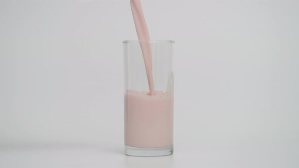 Super Slow Motion of Pouring Chocolate Milk in Transparent Glass at 1000 Fps alt