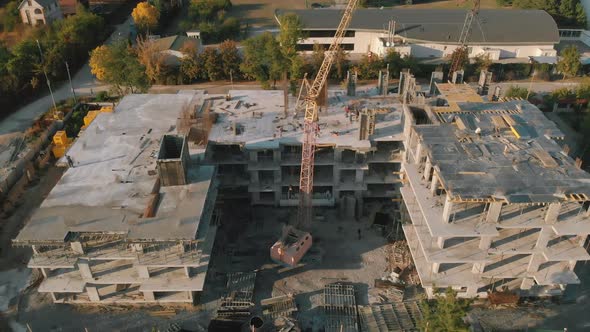 Concrete building aerial view, multi-storey esidential complex construction. alt
