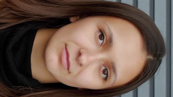 Vertical Video of Business Woman Shyly Smiling Closeup alt