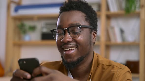 Man Read Funny News on Social Media or Get Text Message and Laugh Spbas alt