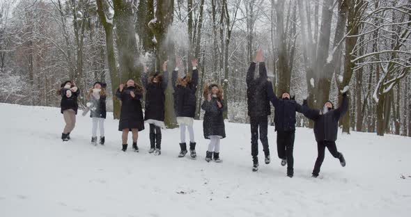 Many Children Throw Snow, Jump And Laugh