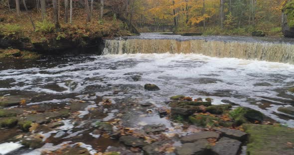Waterfall And Flowing River In Autumn alt
