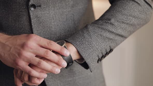 Man Put on Wrist Watch Groom Dresses Male Businessman Waiting for Meeting Hand with Clock alt