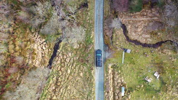 4X4 Pickup Vehicles Driving Through Forest - All Brands Removed alt