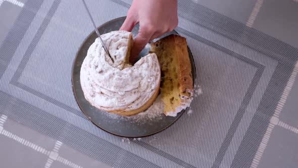 Woman Taking Piece of Traditional Easter Cruffin Cake  Happy Easter Concept alt