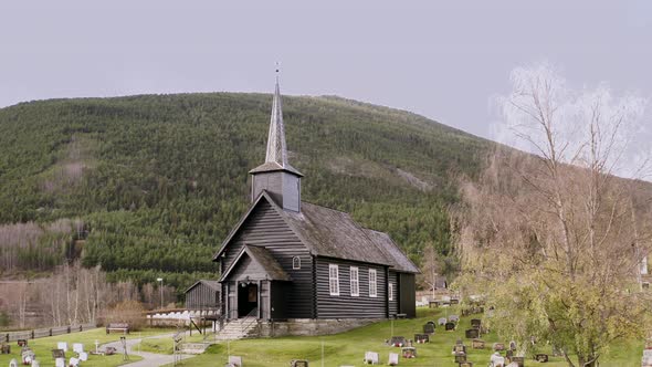 Exterior Of Sel Church In Sel, Norway - aerial pullback alt