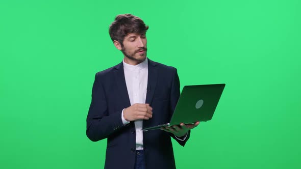 Businessman Lecturer Speaks to the Audience and Give a Lecture Using a Laptop Speaks to Investors alt