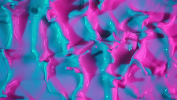 Super Slow Motion Abstract Shot of Swirling Neon Liquid at 1000Fps alt