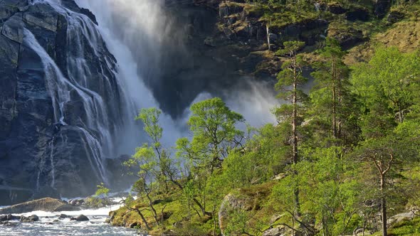 Tilt Shot of a Waterfall in the Central Part of Norway. Spring Summer Sunny Day alt