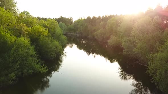 Flight Over the Seim River Ukraine Surrounded By Trees  Aerial Videotaping alt