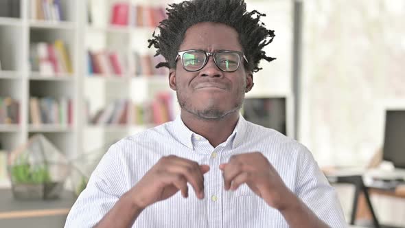 African Man Reacting to Loss alt