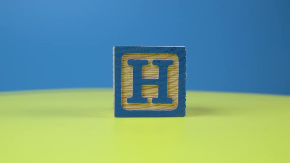 Close up shot letter "H" alphabet wooden block alt