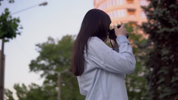 Professional Photographer Working on Street Woman with Photo Camera Making Pic