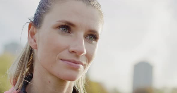 Handheld view of woman checking how many calories she burned  alt