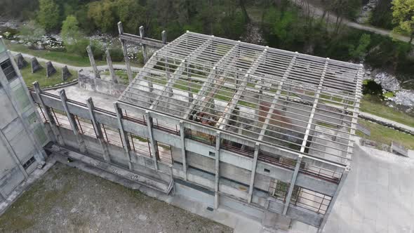 abandoned cement factory monument in the middle of nature drone 4k alt