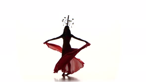 Attractive Belly Dancer Woman Dancing with Candles on Her Head, Silhouette, on White alt