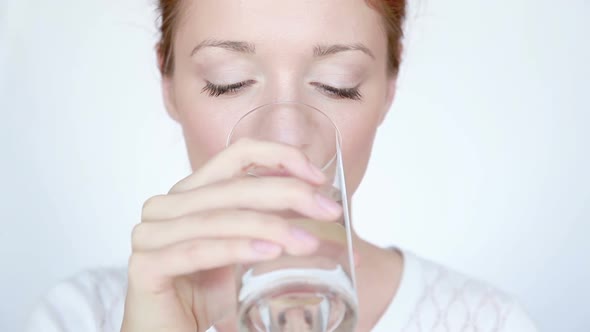 Woman Drinks Water on White Background alt