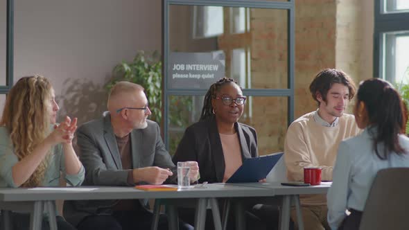 Recruiting Team Interviewing Female Job Candidate alt