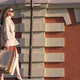 Attractive Woman Holds Shopping Bags Going at Sidewalk After Purchases - VideoHive Item for Sale