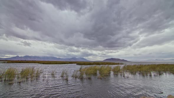 Looking over the marsh of Utah Lake as clouds move through the sky alt
