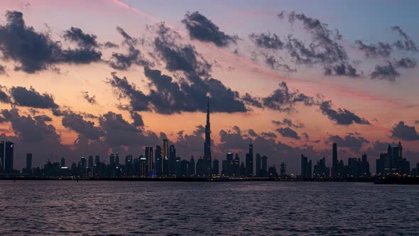 View of Burj Khalifa Skyline From the Dubai Creek Harbour Sunset Timelapse alt