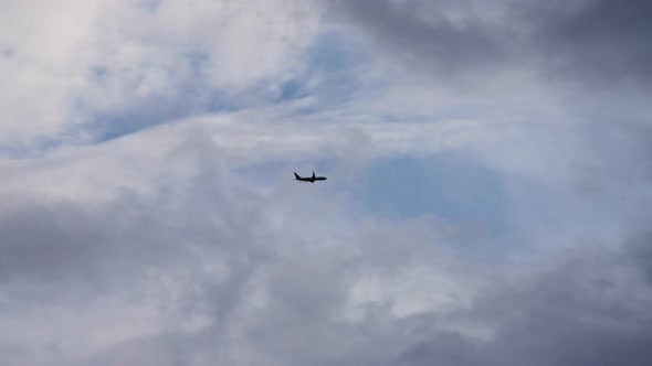 The plane takes off against a cloudy sky alt